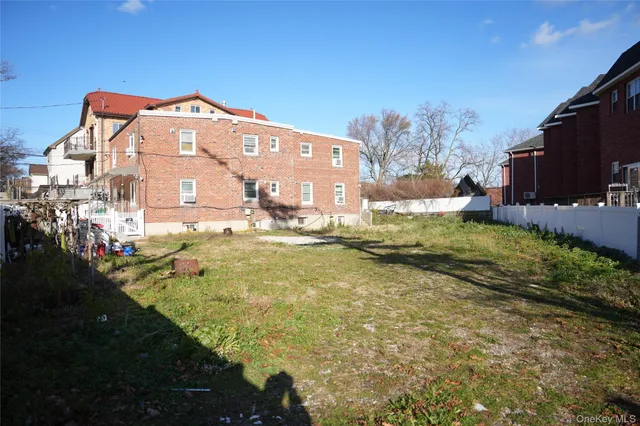a view of a big yard with an outdoor seating
