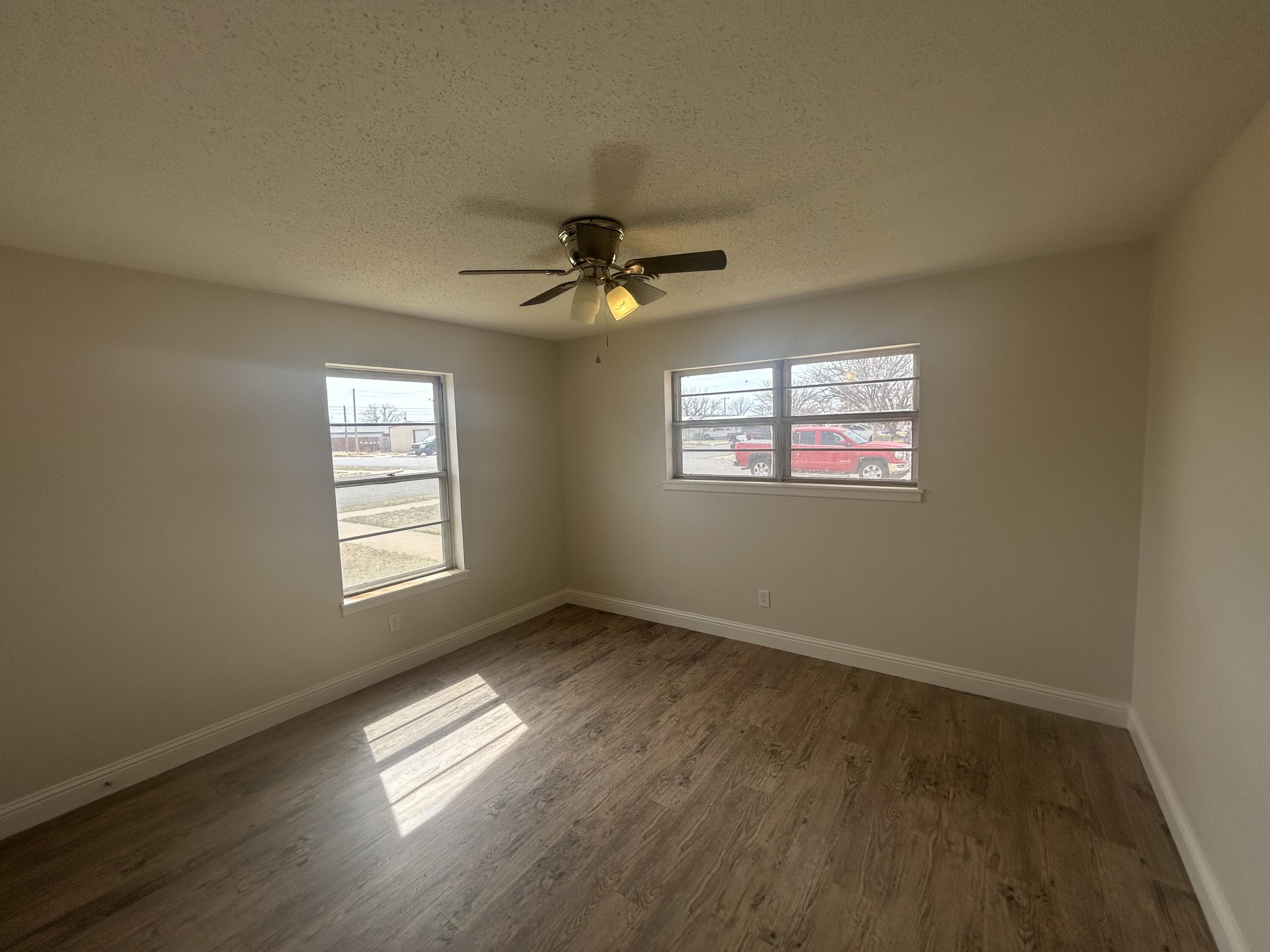 111 Bobby Street Levelland, TX 79336 - Photo 13 of 25 a view of an empty room with a window
