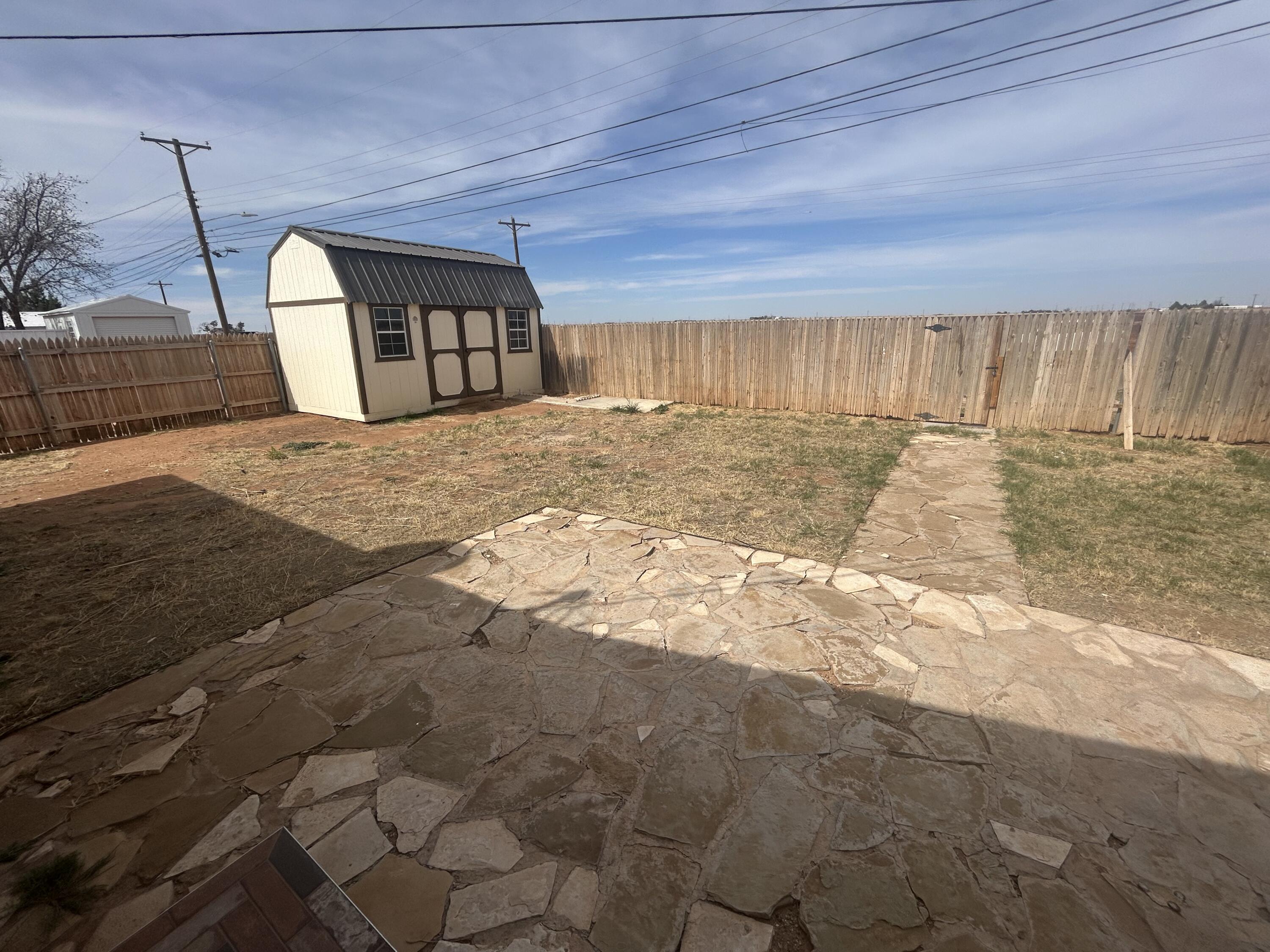111 Bobby Street Levelland, TX 79336 - Photo 21 of 25 a view of a backyard of the house