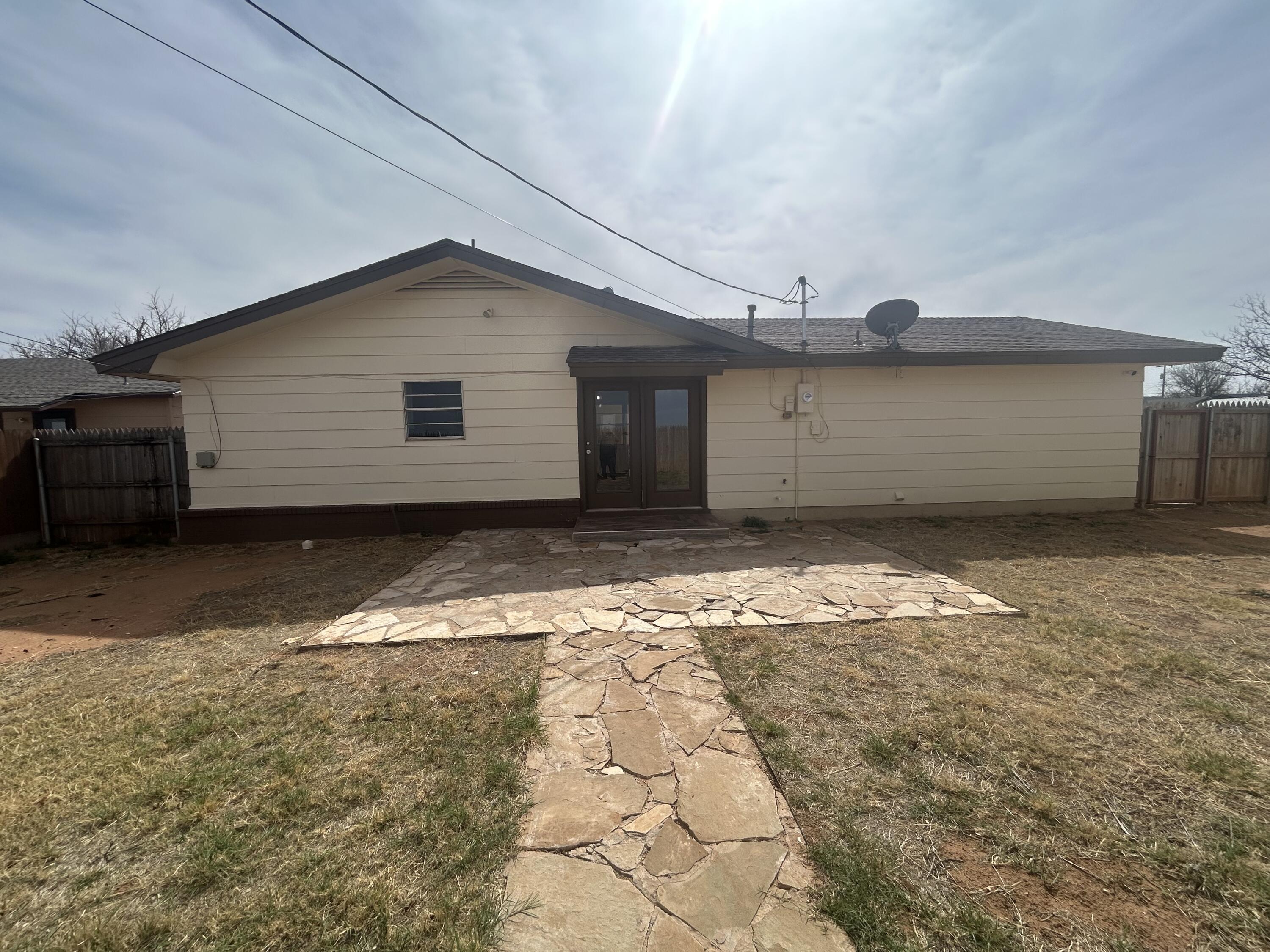 111 Bobby Street Levelland, TX 79336 - Photo 23 of 25 a view of a backyard