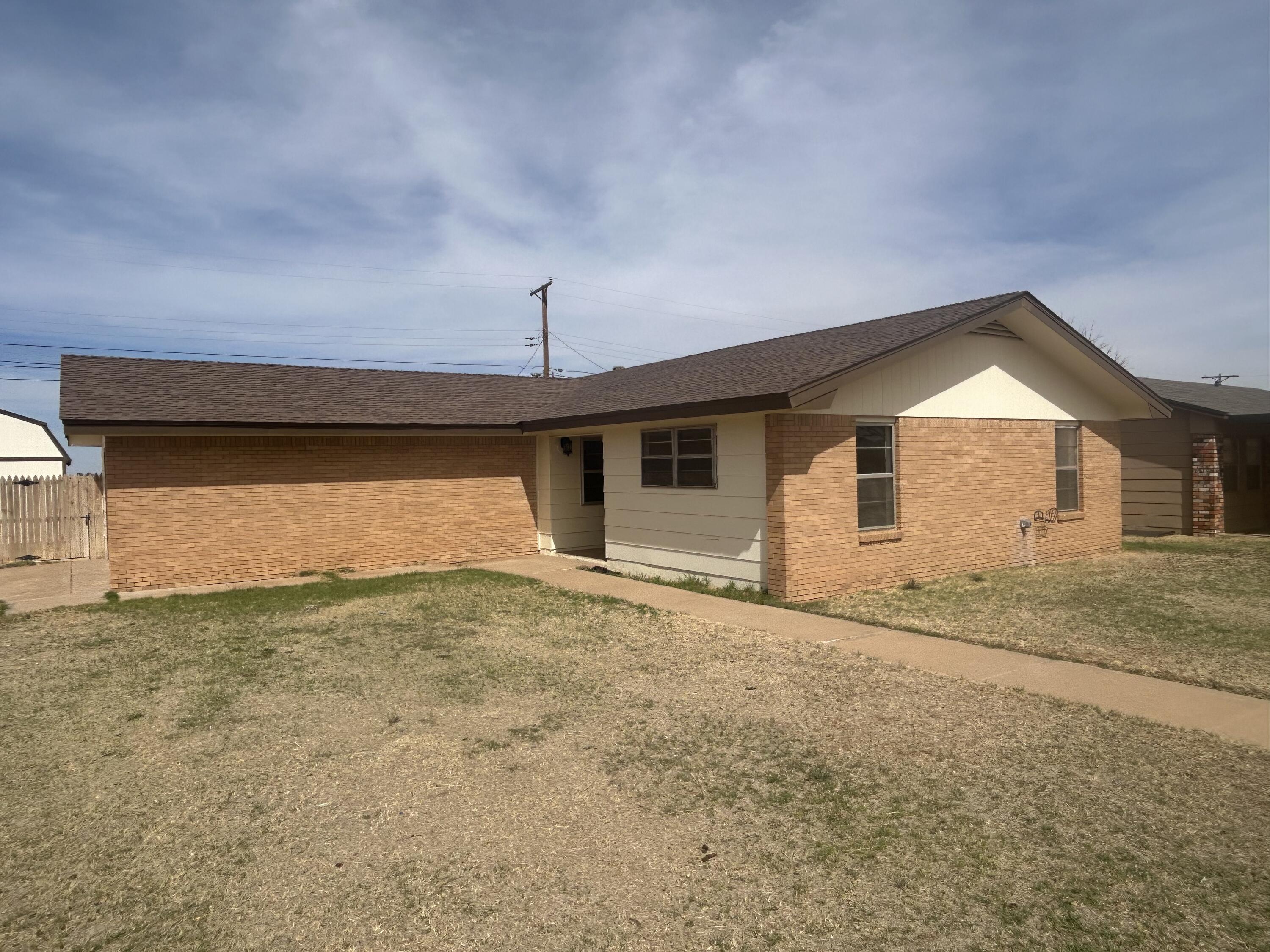 111 Bobby Street Levelland, TX 79336 - Photo 25 of 25 a view of a house with a garage
