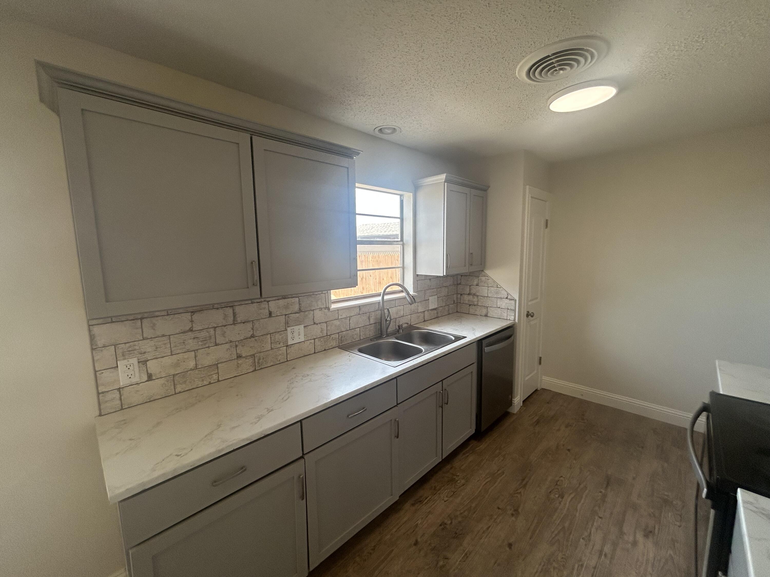 111 Bobby Street Levelland, TX 79336 - Photo 5 of 25 a bathroom with a sink and a vanity