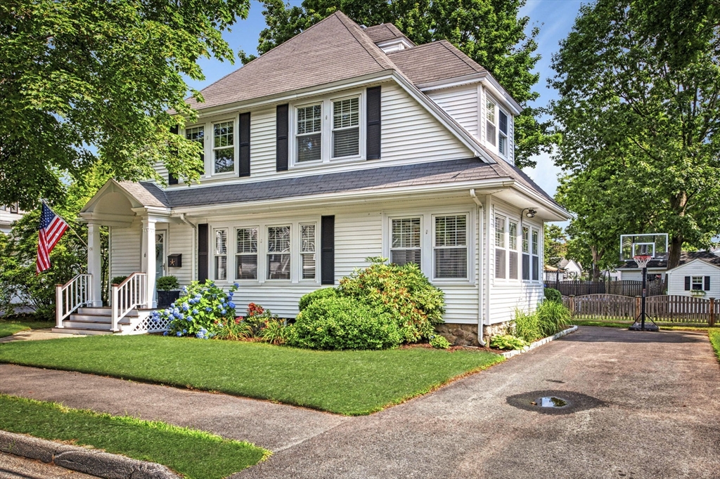 6 Pilgrim Road Marblehead, MA 01945 - Photo 1 of 42 a front view of a house with a garden and plants