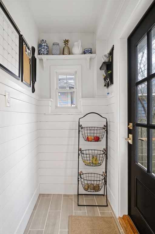 6 Pilgrim Road Marblehead, MA 01945 - Photo 20 of 42 a view of an entryway with rack on the wall