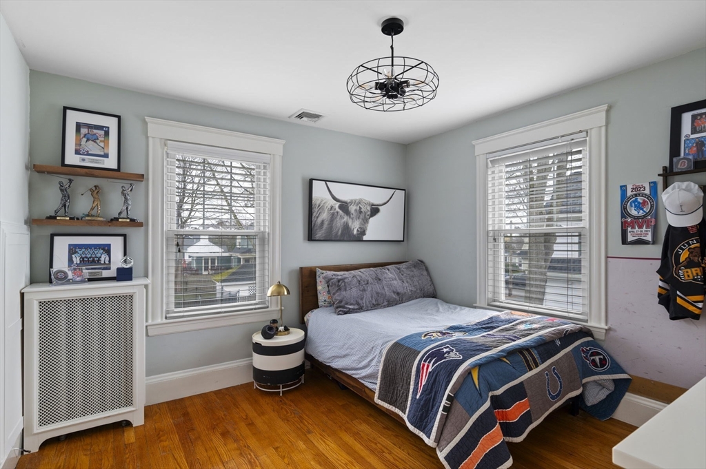 6 Pilgrim Road Marblehead, MA 01945 - Photo 27 of 42 a bedroom with a large bed and a window