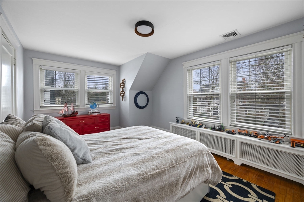 6 Pilgrim Road Marblehead, MA 01945 - Photo 28 of 42 a bedroom with a bed and a large window