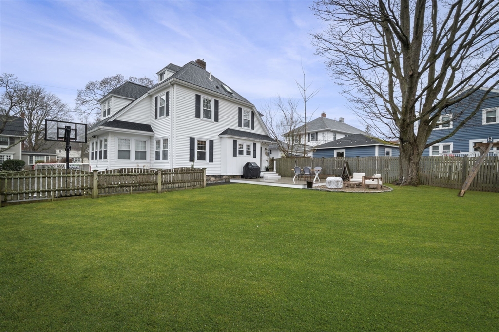 6 Pilgrim Road Marblehead, MA 01945 - Photo 38 of 42 a front view of a house with a garden and trees