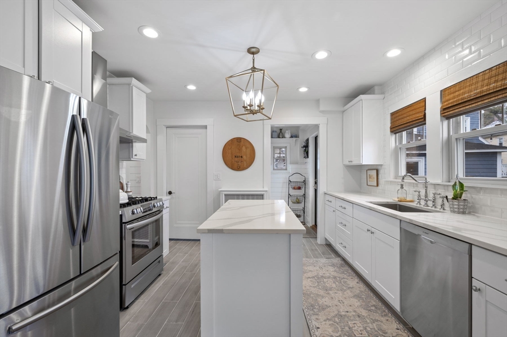 6 Pilgrim Road Marblehead, MA 01945 - Photo 7 of 42 a kitchen with stainless steel appliances granite countertop a sink stove and refrigerator