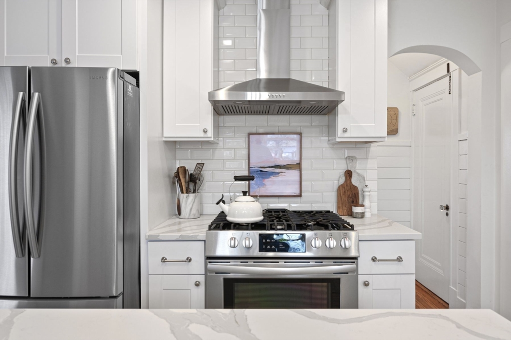 6 Pilgrim Road Marblehead, MA 01945 - Photo 10 of 42 a kitchen with stainless steel appliances granite countertop a stove and a refrigerator