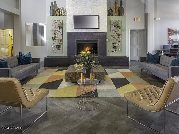 a living room with furniture and a fireplace