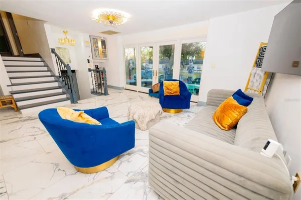 a bedroom with furniture and a flat screen tv