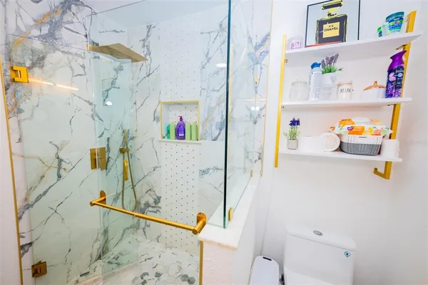 a living room with a baby crib furniture and a dining table