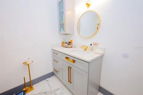 a kitchen with stainless steel appliances granite countertop a refrigerator and a stove