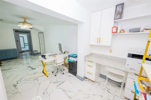 a view of a chairs and table on the wooden deck