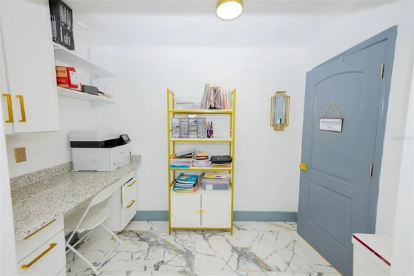 a view of a living room with wooden floor and furniture