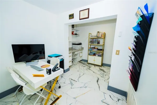a view of living room kitchen and entryway