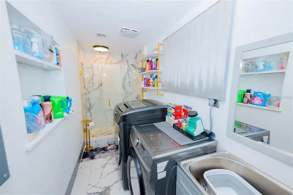 a view of a house with backyard and porch