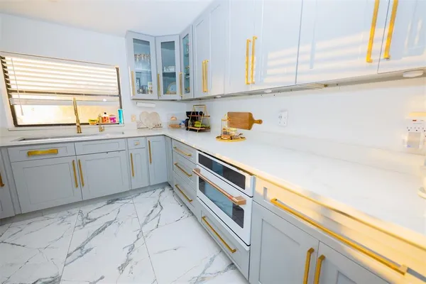 a kitchen with a sink and cabinets