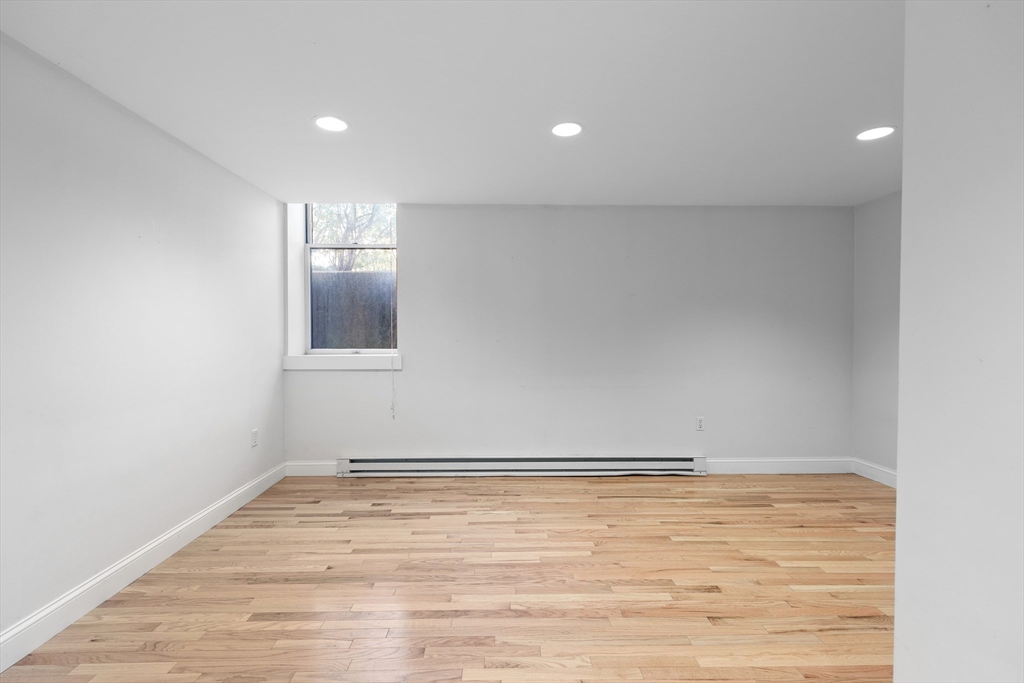 1763 Beacon Street, Unit A Brookline, MA 02445 - Photo 12 of 20 a view of room with wooden floor