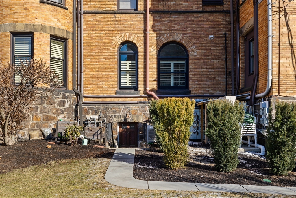 1763 Beacon Street, Unit A Brookline, MA 02445 - Photo 18 of 20 a front view of a house with garden