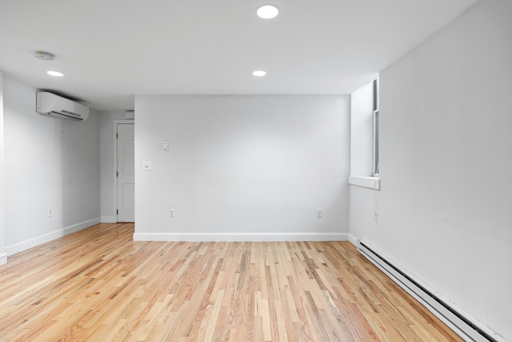 1763 Beacon Street, Unit A Brookline, MA 02445 - Photo 10 of 20 a view of room with wooden floor