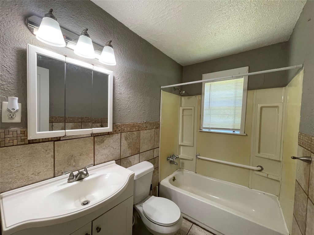 4623 Perry Street Houston, TX 77021 - Photo 7 of 9 a bathroom with a sink toilet and shower