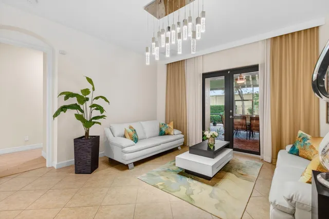 a kitchen with stainless steel appliances kitchen island granite countertop a refrigerator and a stove top oven