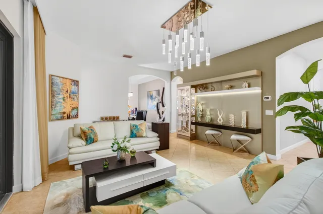 a kitchen with stainless steel appliances kitchen island granite countertop a refrigerator and cabinets