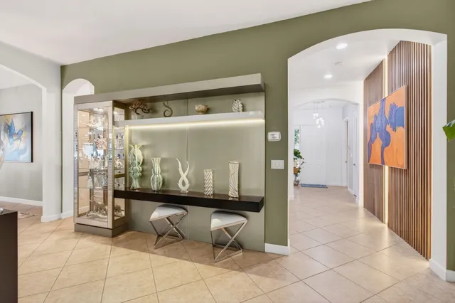 a kitchen with stainless steel appliances a refrigerator and a stove top oven