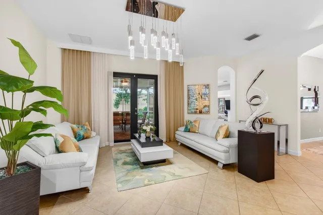 a kitchen with granite countertop a sink stove and refrigerator