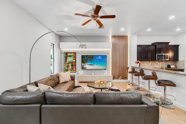 a bedroom with a large bed and a large window