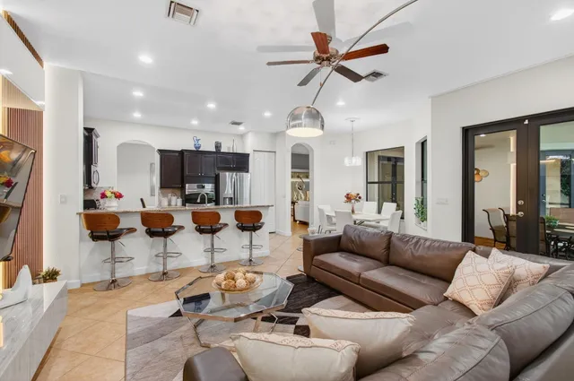 a spacious bathroom with a granite countertop sink and a mirror