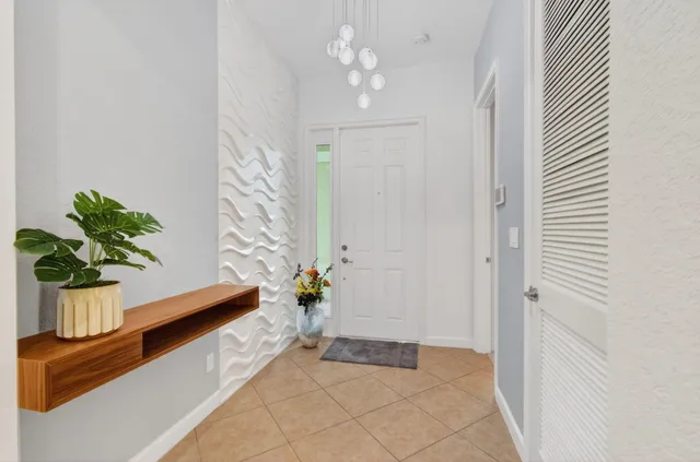 a room with washing machine and mirrors
