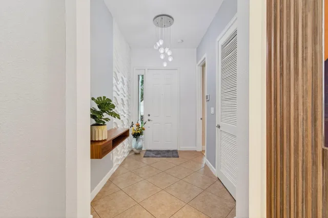 a dining room with furniture a rug and wooden floor