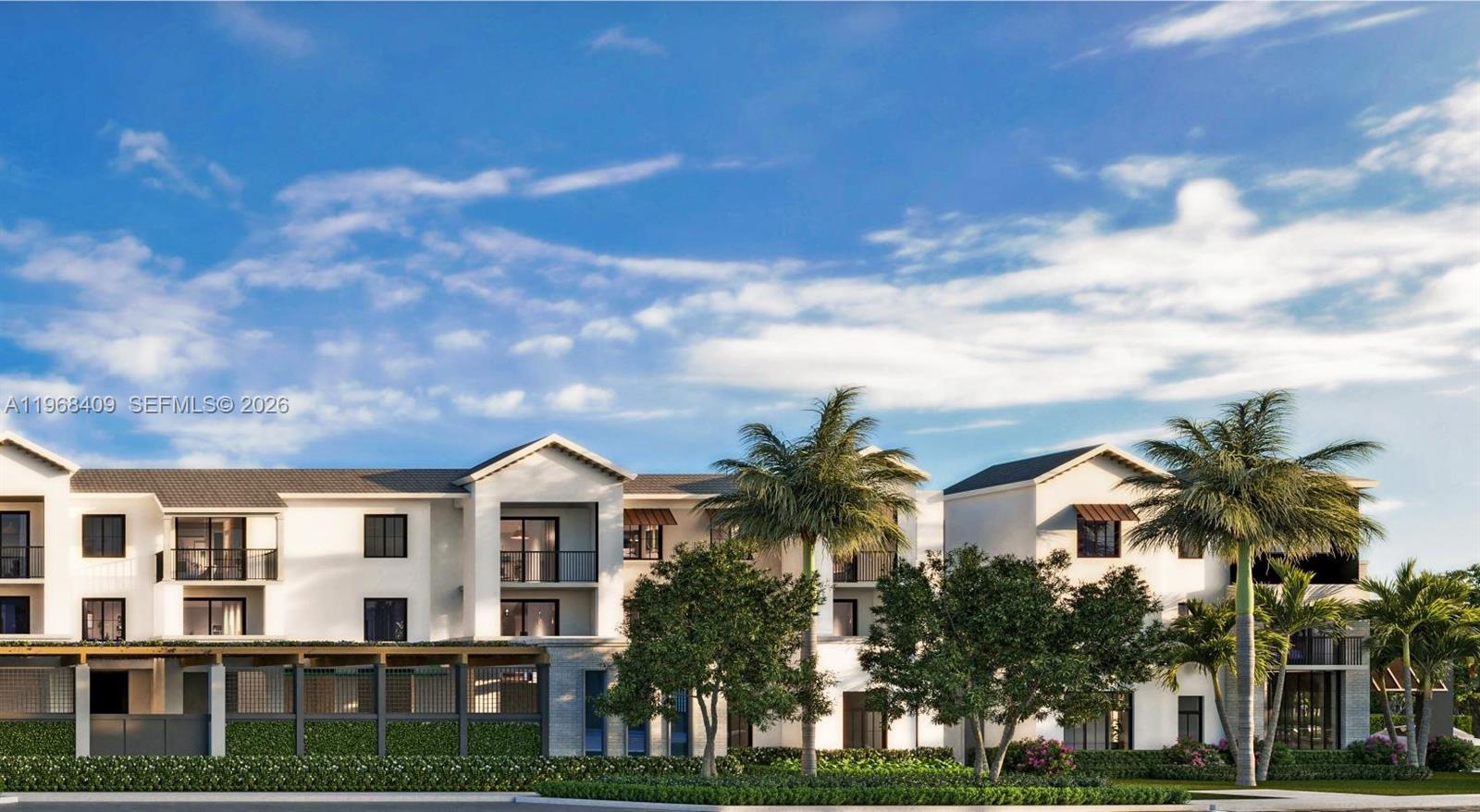 11590 Hagen Ranch Road, Unit A2 Boynton Beach, FL 33437 - Photo 10 of 30 a front view of a house with a yard and palm trees