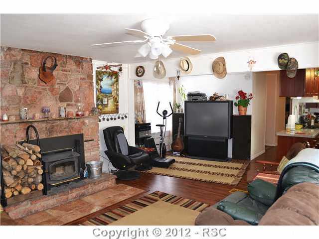 6755 Burrows Road Colorado Springs, CO 80908 - Photo 6 of 16 DON'T WORRY THERE IS PLENTY OF ROOM FOR THE BIG SCREEN.