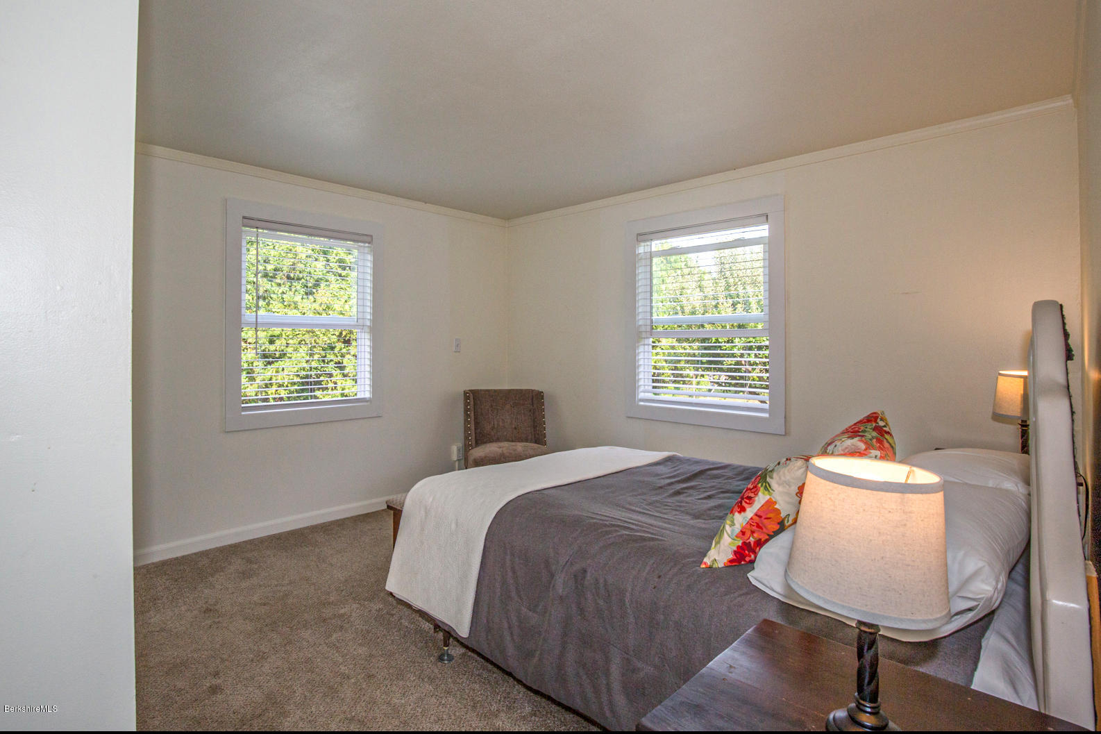 74 East Otis Road Otis, MA 01253 - Photo 22 of 45 a bed sitting in a bedroom next to a window