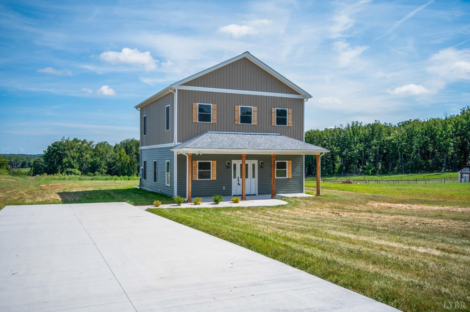 a front view of a house with yard