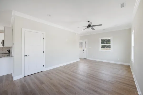 a view of kitchen with wooden floor and window