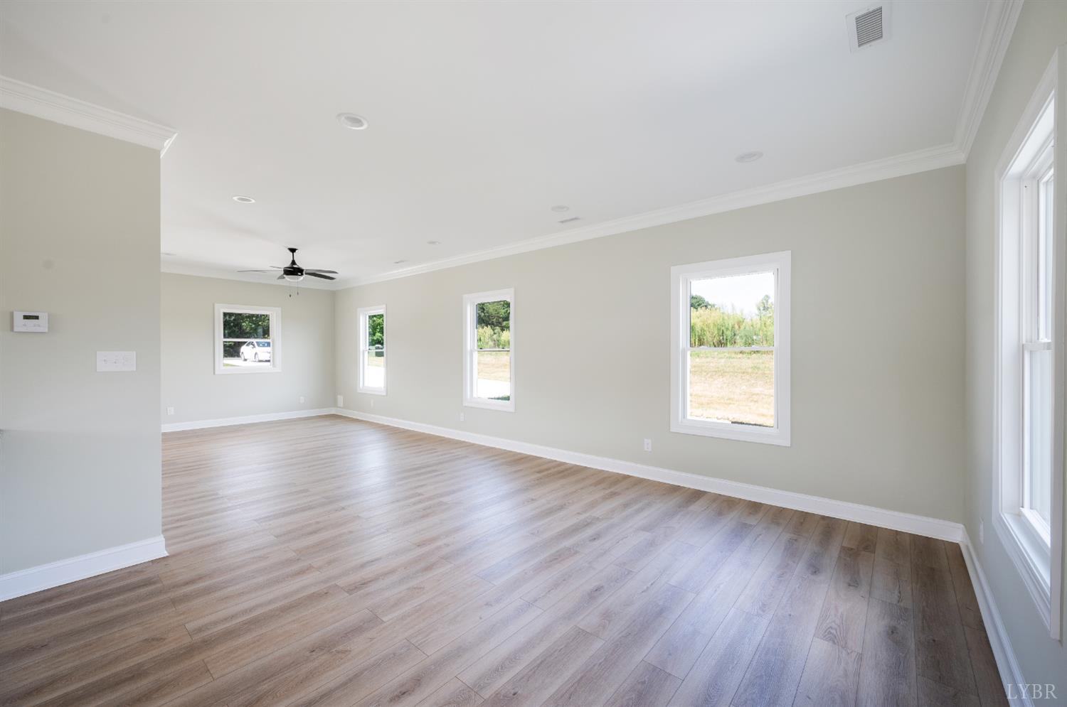 272 Marshall Mill Road Gladys, VA 24554 - Photo 13 of 71 an empty room with wooden floor and windows