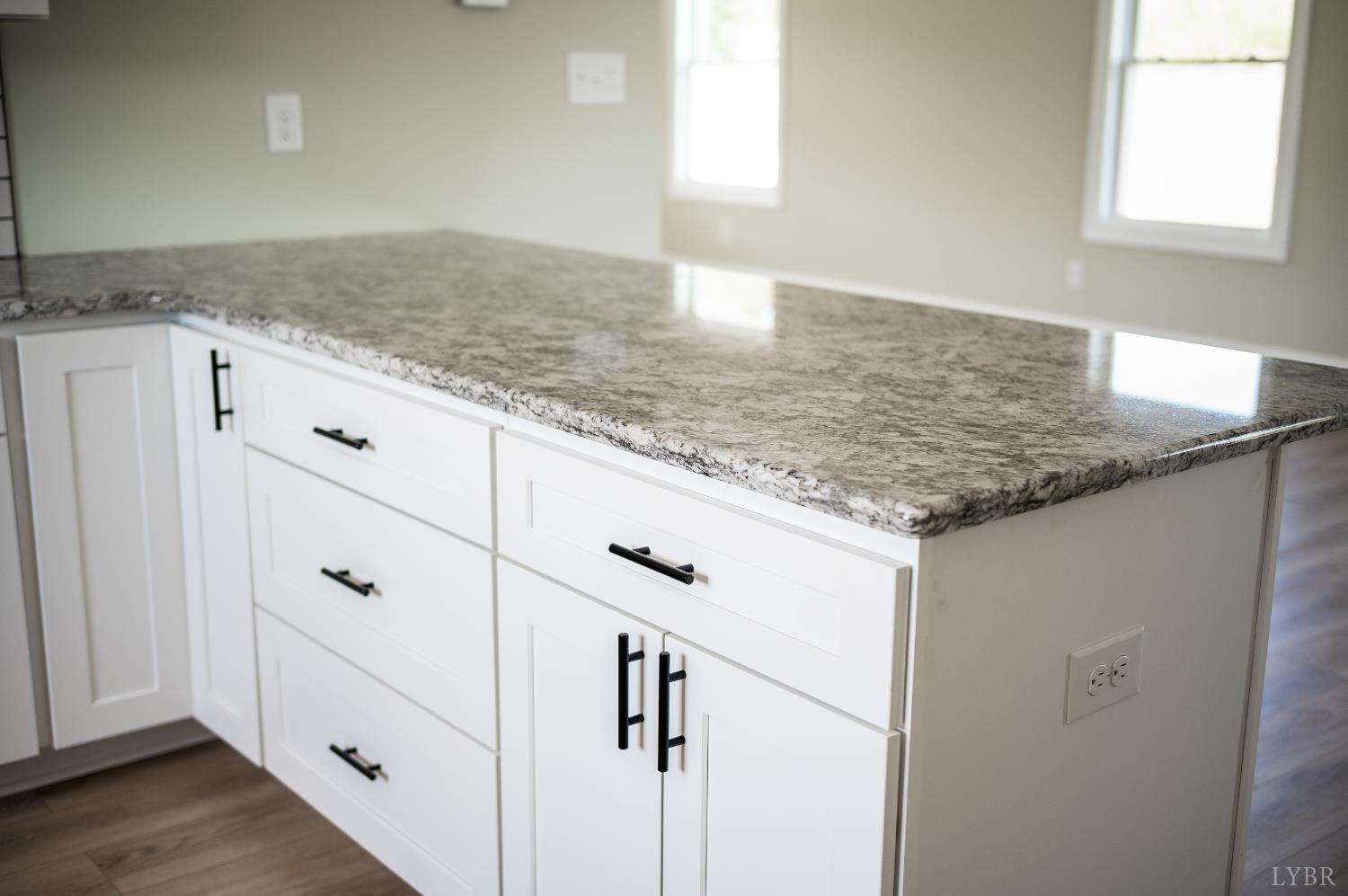 272 Marshall Mill Road Gladys, VA 24554 - Photo 18 of 71 a kitchen with granite countertop white cabinets and white appliances