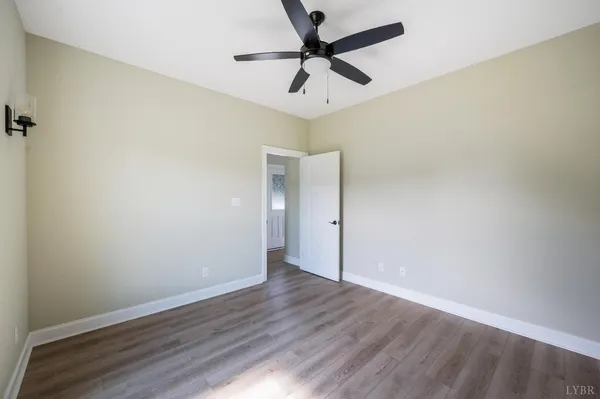 a house with huge green field in front of it