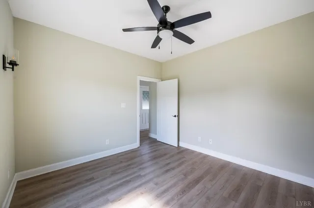a house with huge green field in front of it
