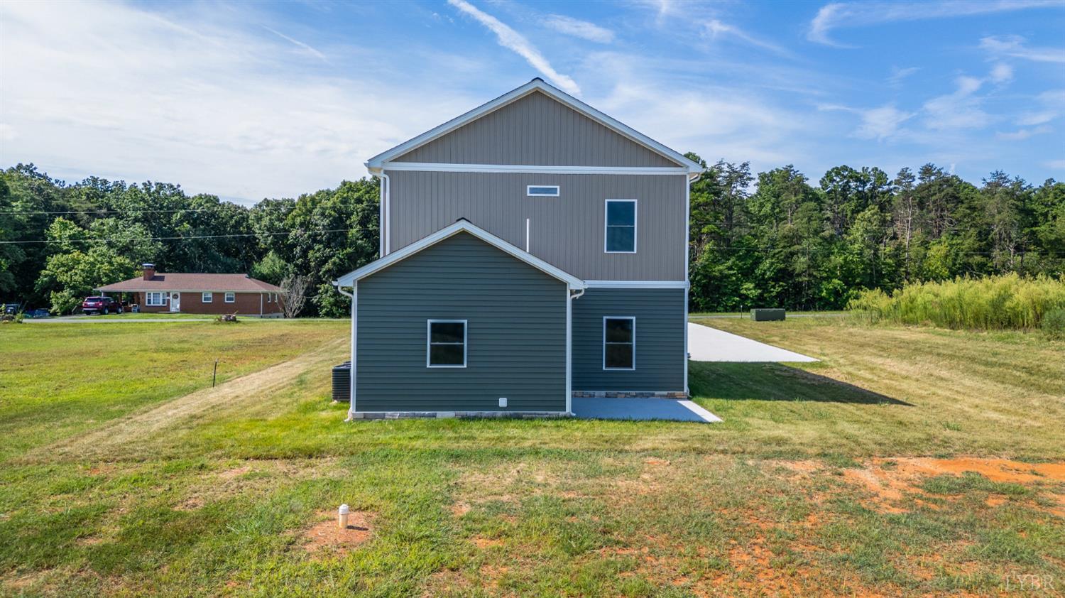 272 Marshall Mill Road Gladys, VA 24554 - Photo 40 of 71 a house with huge green field in front of it