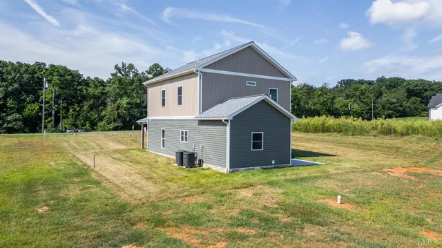 a view of room with wooden floor and ceiling fan