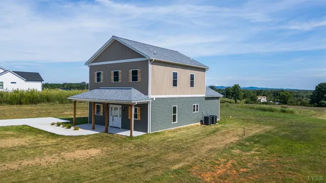 a view of an empty room and wooden floor