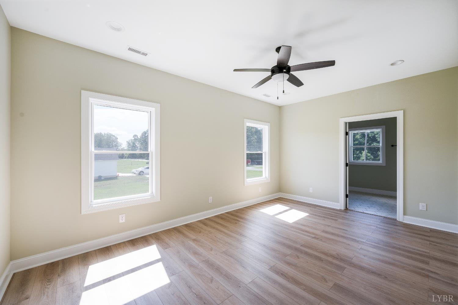 272 Marshall Mill Road Gladys, VA 24554 - Photo 50 of 71 a view of empty room with wooden floor and fan