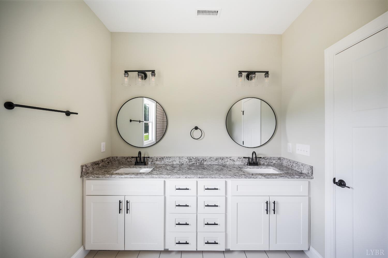 272 Marshall Mill Road Gladys, VA 24554 - Photo 53 of 71 a bathroom with a granite countertop sink and a mirror