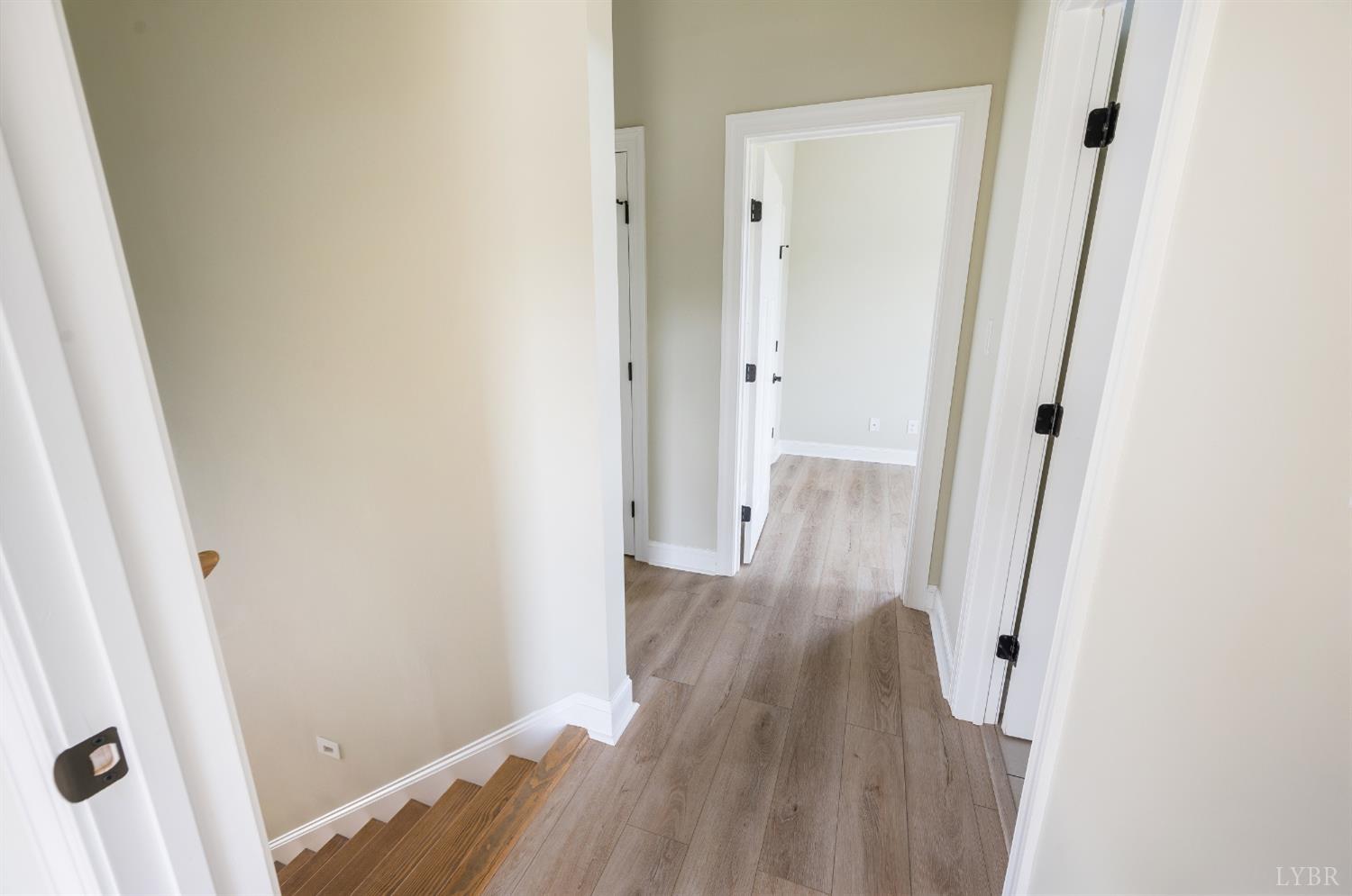 272 Marshall Mill Road Gladys, VA 24554 - Photo 60 of 71 a view of a hallway with wooden floor and staircase