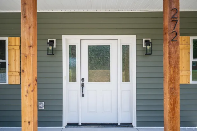 a view of an entryway with wooden floor
